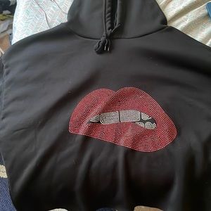 This is a Black Crop top jacket. The size is a 2x. It’s from Citi trends.